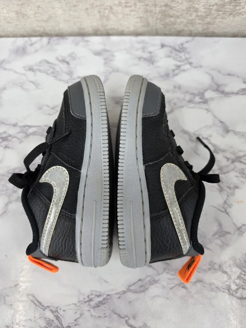 Nike Air Force Lv8 Kids Black & Gray Low-Top Sneakers with Orange Accent